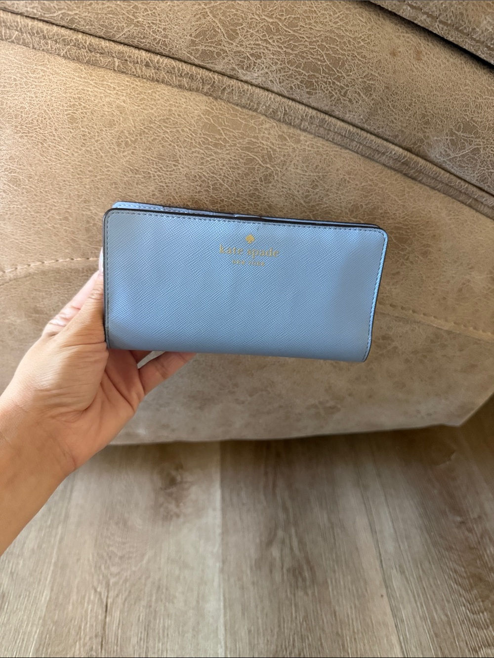 kate spade light blue zip-around wallet with gold logo